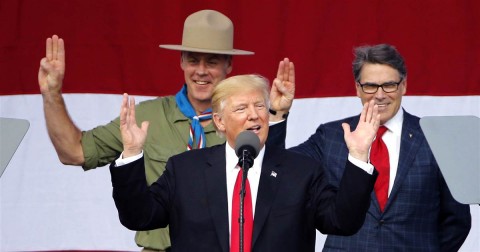 President Donald Trump, front left, gestures as former boy scouts, Interior Secretary Ryan Zinke, left, and Energy Secretary Rick Perry, watch at the 2017 National Boy Scout Jamboree on July 24, 2017. Photo: Steve Helber / AP file photo