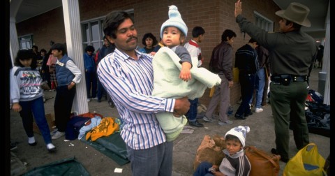 Central American refugees wait outside an Immigration and Naturalization Service processing center in Brownsville, Texas, in 1989. Photo: Shelly Katz / Getty Images