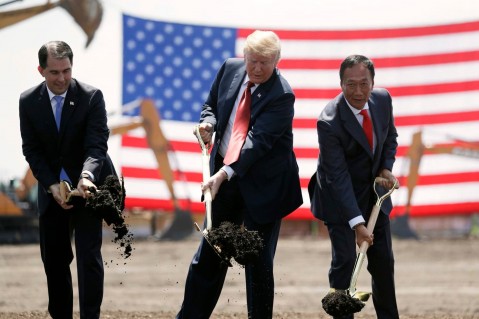 President Trump, Wisconsin Gov. Scott Walker, left, and Foxconn Chairman Terry Gou participate in a groundbreaking event for the new Foxconn facility in Mount Pleasant, Wis., in June 2018. Photo: Evan Vucci/AP