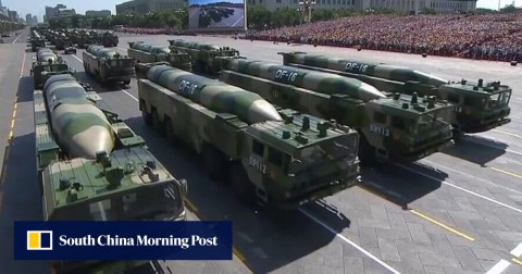 Military vehicles carrying DF-16 ballistic missiles take part in China’s National Day parade. Taiwan says Beijing has such missiles trained on the self-ruled island. 