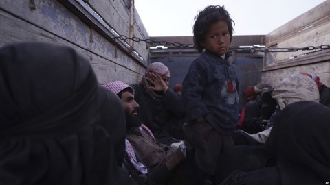 A child stands in the back of a truck after being evacuated out of the last territory held by Islamic State militants, outside Baghuz, Syria, March 4, 2019. Photo: AP