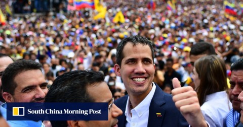 Venezuelan opposition leader and self-proclaimed acting president Juan Guaido gives the thumb’s up during a rally upon his arrival in Caracas on Monday. 