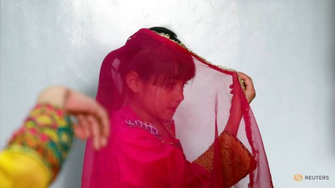 An Afghan girl practices a traditional dance at an Afghan Child Education and Care Organization center (AFCECO) in Kabul, Afghanistan March 3, 2019. 