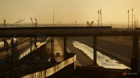 A general view shows the border between Mexico (left) and the United States 