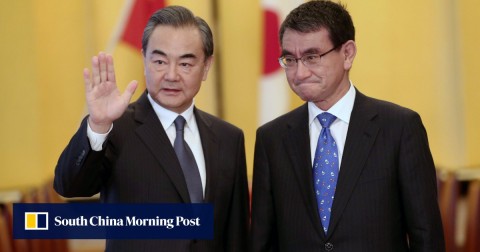 Chinese Foreign Minister Wang Yi (left) and his Japanese counterpart Taro Kono will meet for talks in Beijing on Sunday. 