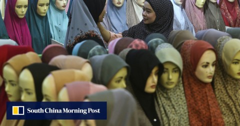 Muslim women shop for headscarves at a Ramadan bazaar in Kuala Lumpur. 