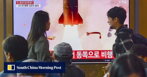 People in Seoul watch a report on North Korea on Thursday after the country fired two unidentified projectiles.