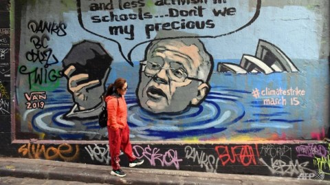 Mural in Melbourne shows Australian Prime Minister Scott Morrison holding a lump of coal as it advertises a rally by students around the world.