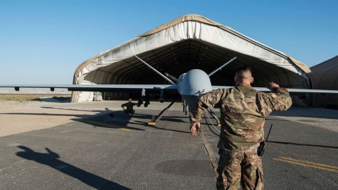 Airmen conduct flight control checks during preflight of a Reaper drone launch.