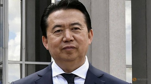 Meng Hongwei poses during a visit to the headquarters of International Police Organisation.