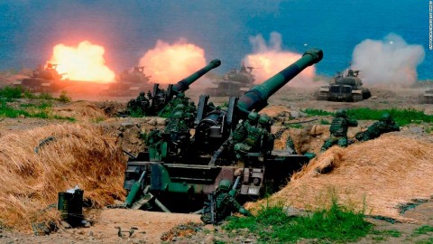 US-made CM-11 tanks are fired in front of two 8-inch self-propelled artillery guns.