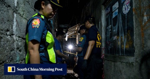Policemen at the scene of a drug-related killing in Manila. 