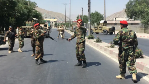 Afghan security forces at the site of previous explosion in Kabul on 1 July.