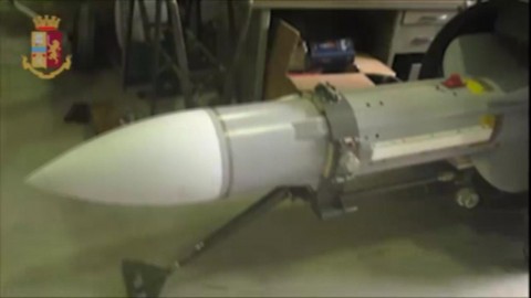 The missile was in a large cache of guns and ammunition.