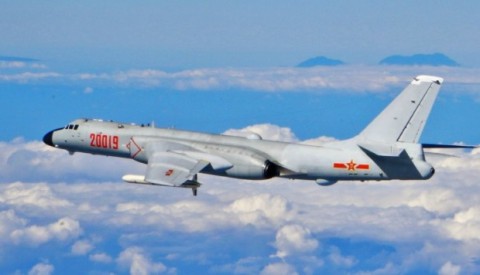 Trump’s security adviser warns Beijing on Guam bomber runs