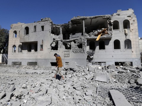 Residents picking over the wreckage of a bombed home in Sanaa. Photo: Getty Images/AFP