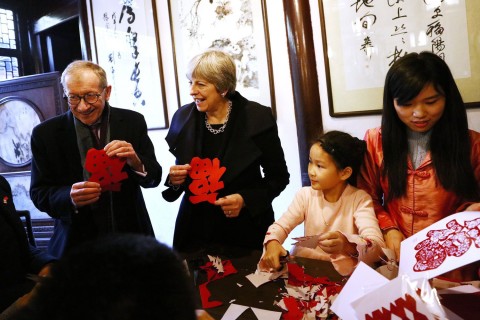 Theresa May and husband Philip on a trip to an education center in Shanghai. Photo: EPA