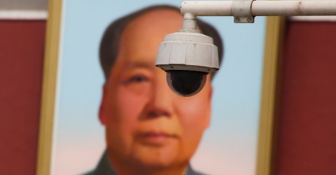 A security camera is attached to a pole in front of the portrait of former Chinese Chairman Mao Zedong on Beijing's Tiananmen Square, on May 19, 2017. Photo: Thomas Peters/Reuters