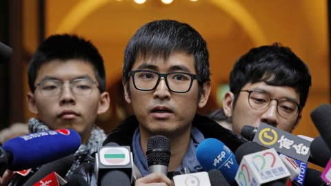 Pro-democracy activist Alex Chow, center, speaks to reporters outside the Court of Final Appeal in Hong Kong, Feb. 6, 2018. Photo: AP