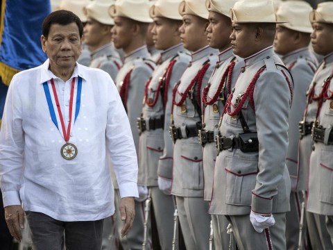 Philippines' President Rodrigo Duterte inspects the honour guards in Manila on 30 December 2017. Photo: Getty