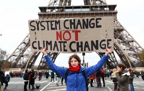 Protesters gather in Paris to highlight the weakness of the COP21 climate agreement, December 12, 2015. Photo: Rex Features via AP Images