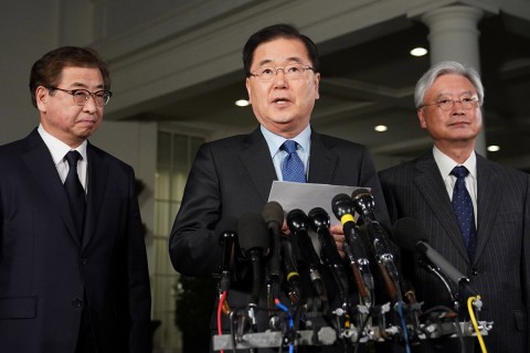 South Korean National Security Advisor Chung Eui-yong (C), flanked by South Korea National Intelligence Service chief Suh Hoon (L) and South Korea’s ambassador to the US Cho Yoon-je (R), briefs reporters outside the West Wing of the White House on March 8, 2018. Photo: Mandel Ngan/AFP/Getty Images