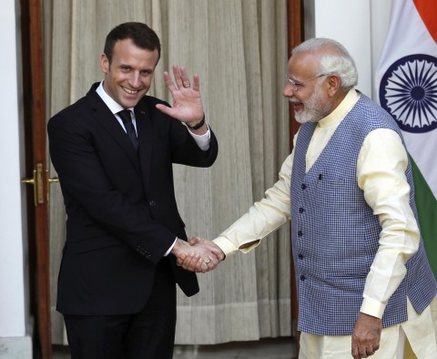  In this March 10, 2018, file photo, French President Emmanuel Macron, left, waves to media as he shakes hand with Indian Prime Minister Narendra Modi before their meeting in New Delhi, India. India and France have pledged to work together to ensure freedom of navigation in the Indian Ocean amid China’s increasing presence in the area. Photo: Manish Swarup / AP