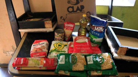 The contents of a CLAP box, a Venezuelan government handout of basic food supplies, is pictured at Viviana Colmenares' house in the slum of Petare in Caracas, Feb. 23, 2018. Photo: Reuters