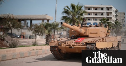 A Turkish tank rolls into Afrin after the northern Syrian city was seized from Kurdish forces. Photograph: Anadolu Agency/Getty Images