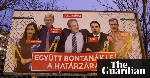  A Fidesz party poster features the billionaire George Soros and rival candidates holding bolt cutters after having cut the border fence behind them. Photograph: Adam Berry/Getty Images