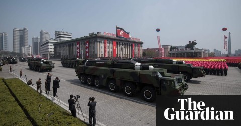 An unidentified missile and mobile launcher pass through Kim Il-sung Square in Pyongyang. Photo: Ed Jones/AFP/Getty Images
