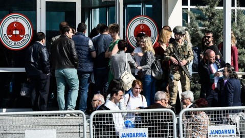 People gather outside the Cumhuriyet trial courtroom in Isanbul. Photo: Getty Images / AFP / Y. Akgul