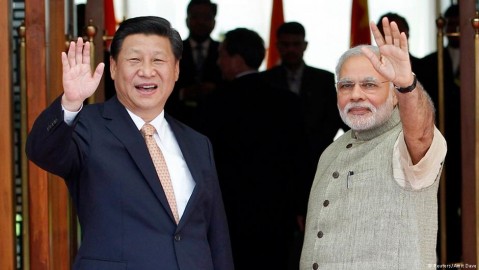 Xi Ji-ping with India’s Modi in Ahmedabad, Sept. 17, 2014. Photo: Photo: Amit Dave / Reuters