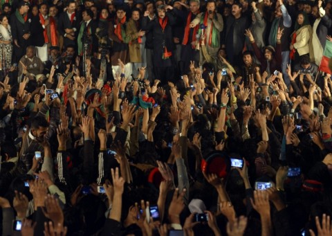Supporters of Imran Khan listen as he speaks at an anti-government protest December 15, 2014. Photo: Getty Images