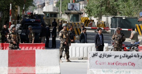 Afghan security forces stand guard near the site of the blast in Kabul on April 30. Photo: Omar Sobhani / Reuters