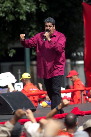 While Venezuelan President Nicolas Maduro (left) and Argentine President Mauricio Marci may share a title, they couldn't be more ideologically divided. And that divide is matched by a personal animosity. Photos: Ariana Cubillos / AP