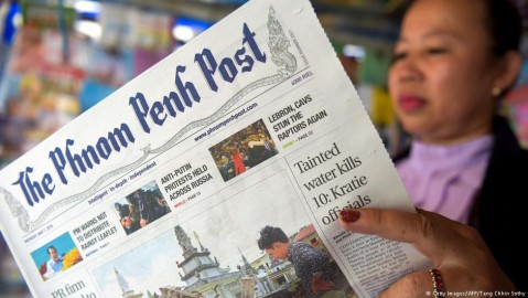 A woman reads the Phnom Penh Post. Photo: Tang Chhin Sothy / Gerry Images / AFP
