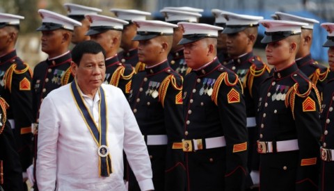 Filipino President Rodrigo Duterte reviews an honor guard during the 120th Philipping Navy Anniversary celebration in Manila Wednesday. Photo: EPA-EFE