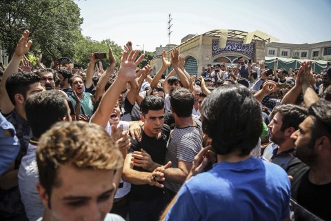 Iranians take to streets of Tehran in biggest protests since 2012