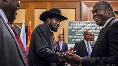 President Kiir and opposition leader Machar shake hands during the peace talks. Photo: M. Ayene/AP